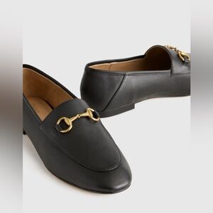Quince Black Loafers with Gold Accent